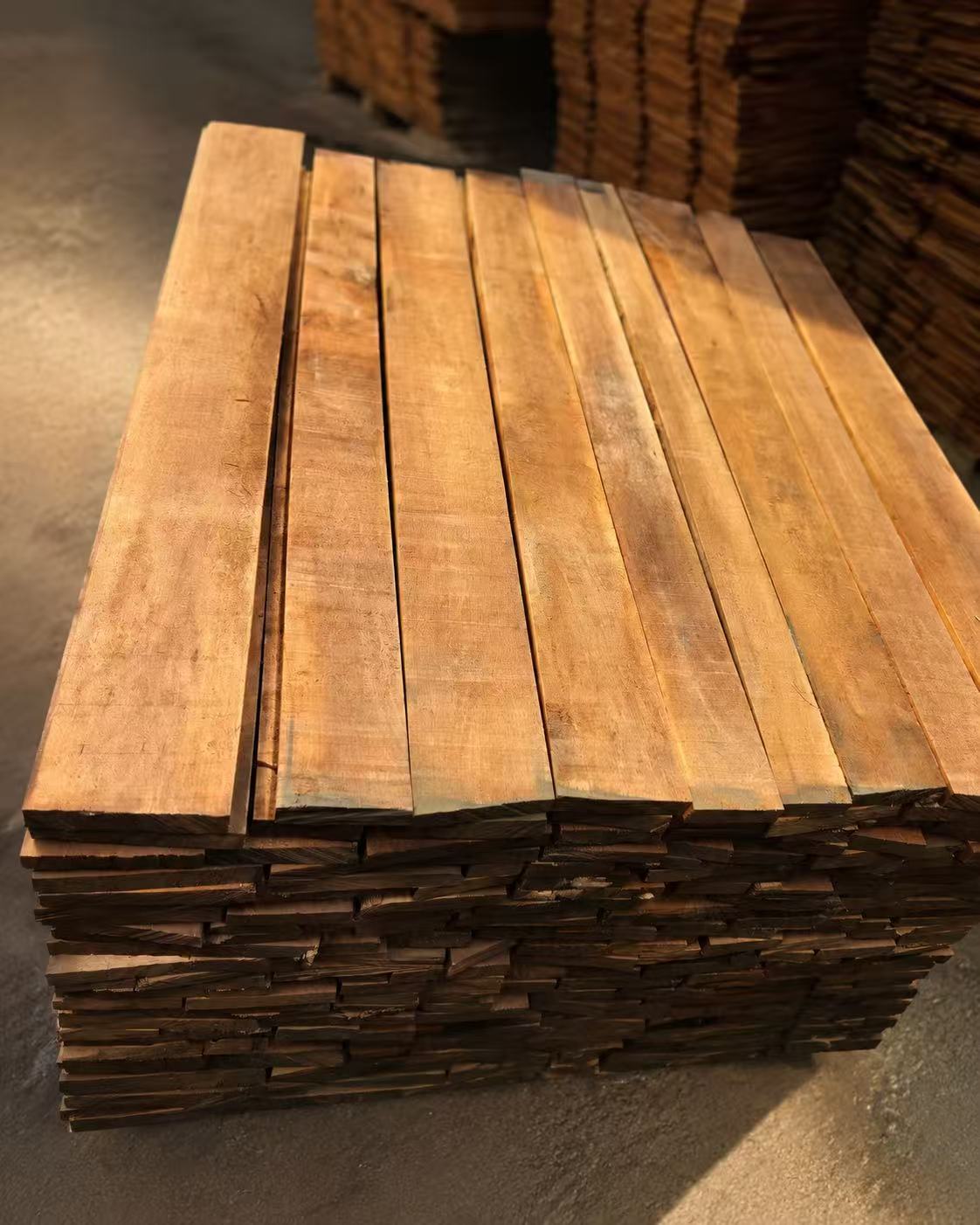 Natural wood boards showing grain, surface quality and raw material preparation for wooden hanger manufacturing.